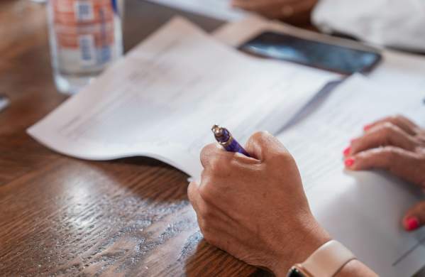 A woman filling out a loan application.