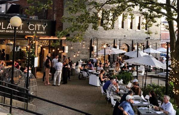 People eating on the patio of Plant City in Providence, RI.